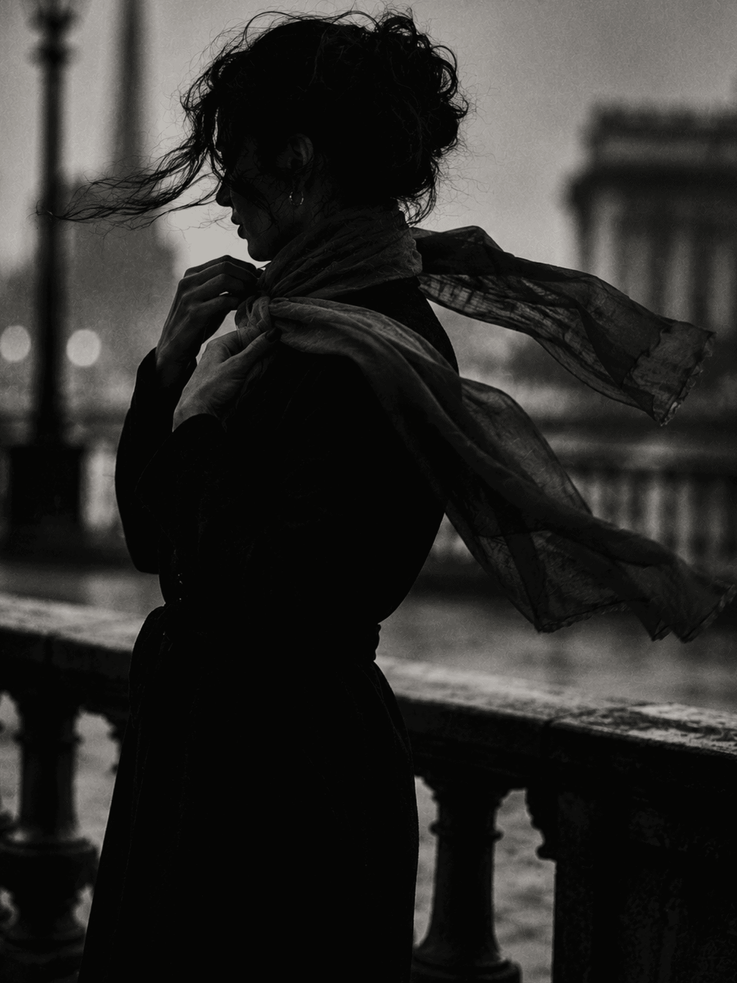 Windswept Silhouette black and white photography wall art print of a woman with wind-blown hair and scarf at a stone balustrade — digital download.