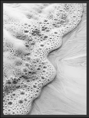 Main: Black and white aerial photograph of sea foam bubbles receding across wet sand at the shoreline — fine art coastal wall art digital download. Short fallback: Black and white sea foam wall art print.